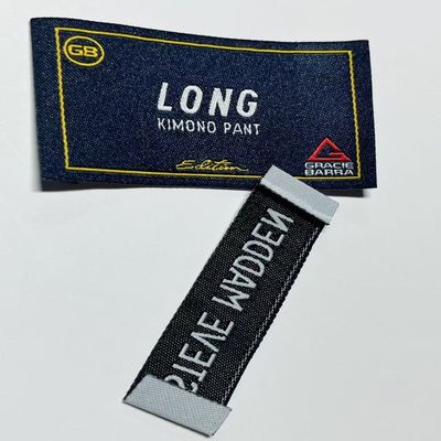 Etiquetas de ropa tejida bordada con corte ultrasónico Etiquetas de ropa personalizadas