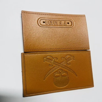 Etiquetas personalizadas de cuero cosidas en el cierre Tipo personalizado para requisitos individuales
